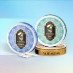 Two Round Tins of Alibarbar Mint Tobacco with Intricate Mandala Designs Blue and Green Labels Stacked on a Gold Base - Australia E-cigarette Store
