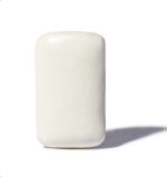 Single White Marshmallow Standing Upright on a White Surface with a Soft Shadow to the Right - Australia E-cigarette Store