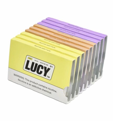 Pack of Lucy nicotine gum boxes with multi-colored pastel sticks arranged in rows; yellow front panel and warning label visible on the box edge.