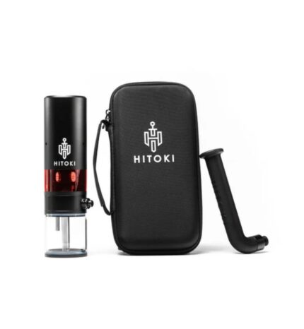 Hitoki laser-powered smoking device with glass chamber and red heat capsule, beside a black HITOKI carrying case and curved mouthpiece.