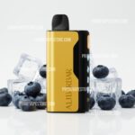 Gold and Black Vape Device Standing Amid Ice Cubes and Blueberries on a White Surface promotional Product Shot - Australia E-cigarette Store