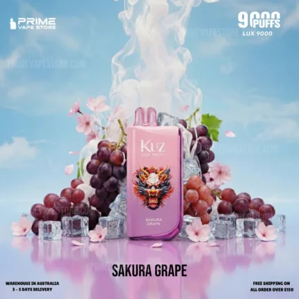 Pink Kuz Lux 9000 Sakura Grape Vape Device Front and Center with Grapes and Ice Cubes Against a Blue Sky Backdrop Cherry Blossoms Nearby - Australia E-cigarette Store