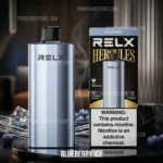 Relx Vaping Device Standing Beside a Blueberry Ice Flavor Box on a Reflective Surface with Blueberries in the Background - Australia E-cigarette Store