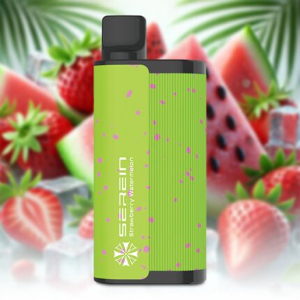 Close-up of a lime-green vape device with pink paint splatters against a blurred fruit background.