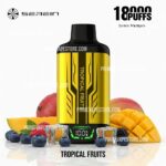 Tropical Fruits E-liquid Bottle with a Yellow and Black Label Surrounded by Mango Chunks Berries Ice Cubes and Diced Mango - Australia E-cigarette Store