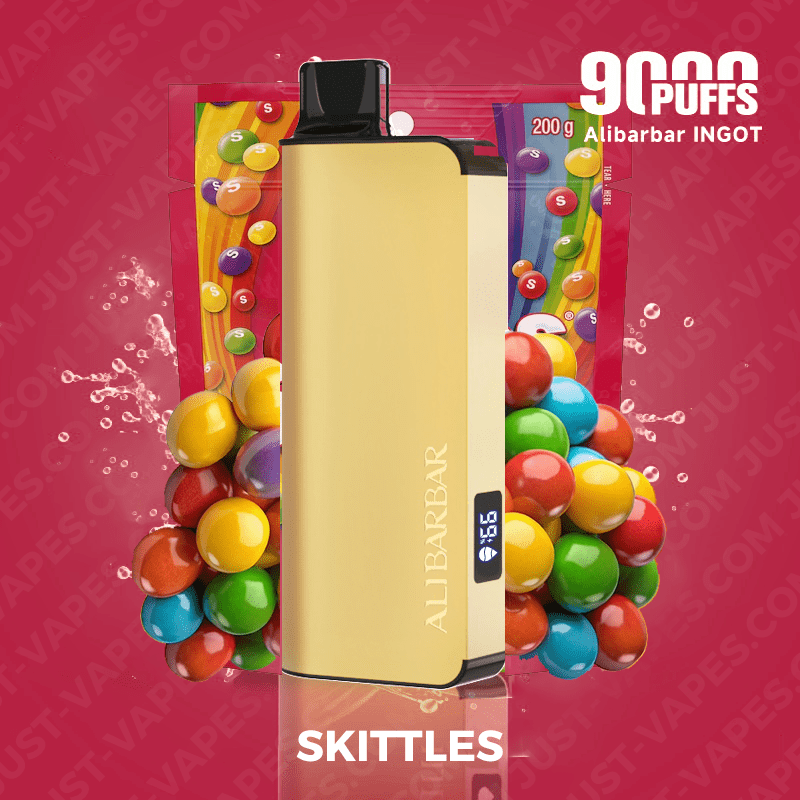 Gold Allbar Vape Device with a Digital Display Stands Upright Between Colorful Skittles Candy Set Against a Pink Background in an Advertisement with 9000 Puffs and skittles Branding at the Bottom - Australia E-cigarette Store